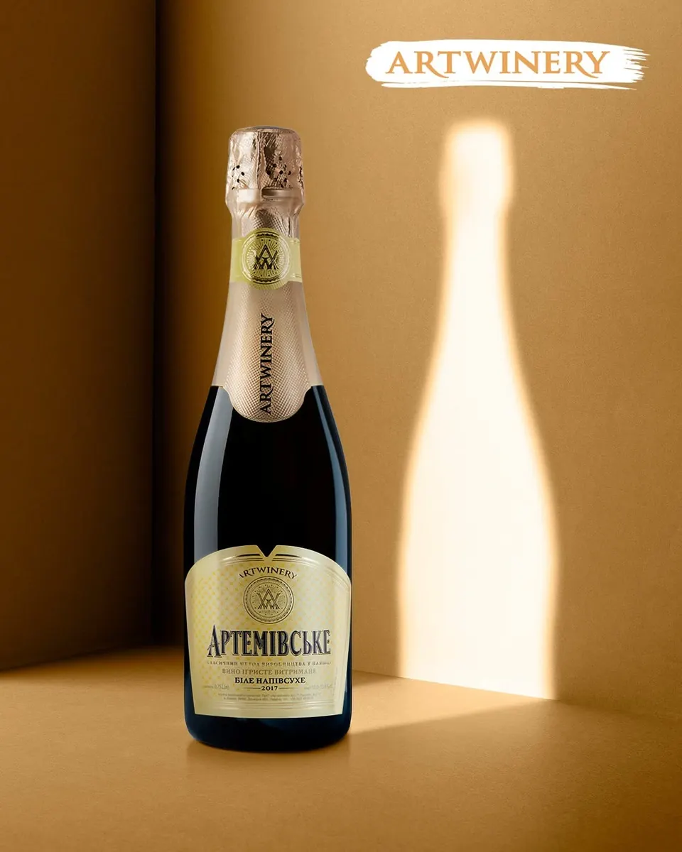 Champagne bottle with a glowing bottle-shaped shadow